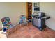 Outdoor patio area features a grill, shelves, and colorful beach chairs at 1605 Manor Rd, Englewood, FL 34223