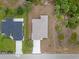 Birds eye view showcases the house's roof, driveway, and proximity to the neighboring property at 1664 Karluk St, North Port, FL 34287