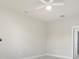 Bedroom features a ceiling fan, neutral paint, and access to the bathroom at 1664 Karluk St, North Port, FL 34287