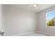 Bright bedroom with modern ceiling fan and large window offering natural light and treetop views at 1664 Karluk St, North Port, FL 34287