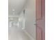 Bright entryway features tiled floors and recessed lighting and offers a glimpse into the kitchen at 1664 Karluk St, North Port, FL 34287