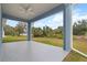 Enjoy the outdoors with this covered patio, perfect for entertaining, with views of the yard at 1664 Karluk St, North Port, FL 34287