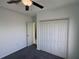 This bedroom offers neutral walls, ceiling fan and closet space at 169 Boundary Blvd # 169P, Rotonda West, FL 33947