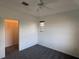 Bedroom with neutral carpet, ceiling fan, and window with closet at 169 Boundary Blvd # 169P, Rotonda West, FL 33947