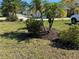 Lush landscaping and healthy green lawn accentuate the front yard of this delightful home at 169 Boundary Blvd # 169P, Rotonda West, FL 33947