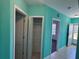 Well lit hallway featuring an storage area, doorway and outdoor access at 169 Boundary Blvd # 169P, Rotonda West, FL 33947