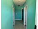 Hallway featuring tiled flooring and doorway access to other rooms at 169 Boundary Blvd # 169P, Rotonda West, FL 33947