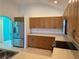Spacious kitchen featuring stainless steel appliances and ample cabinet space at 169 Boundary Blvd # 169P, Rotonda West, FL 33947