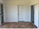 Spacious outdoor lanai featuring tile flooring, a door and multiple sliding doors for easy access and natural light at 169 Boundary Blvd # 169P, Rotonda West, FL 33947
