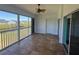 Enclosed lanai features tile flooring, ceiling fan, views and access to the outdoors at 169 Boundary Blvd # 169P, Rotonda West, FL 33947