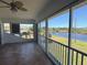 Spacious lanai with tile flooring, sliding doors, and scenic pond view for relaxation at 169 Boundary Blvd # 169P, Rotonda West, FL 33947