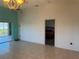 Bright living room with tile flooring, leading to a balcony and view to a bedroom at 169 Boundary Blvd # 169P, Rotonda West, FL 33947