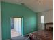 Main bedroom featuring light colored walls and a door leading to outdoor space at 169 Boundary Blvd # 169P, Rotonda West, FL 33947
