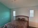 Spacious main bedroom with carpet, two windows and a queen bed at 169 Boundary Blvd # 169P, Rotonda West, FL 33947