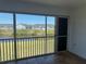 Enclosed patio with sliding windows offering scenic views of the pond and pool at 169 Boundary Blvd # 169P, Rotonda West, FL 33947