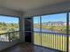 Enclosed patio with sliding windows offering scenic views of the pond and pool at 169 Boundary Blvd # 169P, Rotonda West, FL 33947