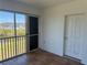 Enclosed patio with sliding windows offering scenic views of the pond and pool at 169 Boundary Blvd # 169P, Rotonda West, FL 33947