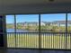 Enclosed patio with sliding windows offering scenic views of the pond and pool at 169 Boundary Blvd # 169P, Rotonda West, FL 33947