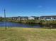 Scenic pond view from the property with manicured green grass at 169 Boundary Blvd # 169P, Rotonda West, FL 33947