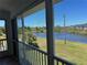 Screened in patio offering scenic pond views and lush landscaping at 169 Boundary Blvd # 169P, Rotonda West, FL 33947