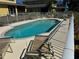 Community pool surrounded by lounge chairs, providing an ideal area for relaxation and socializing at 169 Boundary Blvd # 169P, Rotonda West, FL 33947