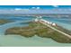 Breathtaking aerial view of coastal property with pristine waters and scenic roadways at 1691 Lakeview Pl, Englewood, FL 34223