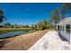 Backyard view showing a patio, waterway, and green space at 1691 Lakeview Pl, Englewood, FL 34223