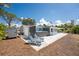 The backyard features a spa, lounge chairs, and a well-manicured lawn at 1691 Lakeview Pl, Englewood, FL 34223