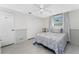 Bright bedroom features a comfortable bed, ample closet space, and a large window at 1691 Lakeview Pl, Englewood, FL 34223