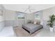 Comfortable bedroom features two large windows, neutral decor, and a cozy atmosphere at 1691 Lakeview Pl, Englewood, FL 34223