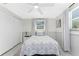 Bright bedroom with a comfortable bed, closet, and natural light at 1691 Lakeview Pl, Englewood, FL 34223