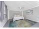 Spacious bedroom with ceiling fan, art, and soft natural light at 1691 Lakeview Pl, Englewood, FL 34223