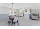 The dining room area leads to the kitchen and has seating for four at 1691 Lakeview Pl, Englewood, FL 34223