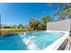 Enjoy a rejuvenating dip in the hot tub, complemented by serene canal views and the relaxing presence of palm trees at 1691 Lakeview Pl, Englewood, FL 34223