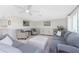 Open-concept living room with ample seating, natural light, and inviting ambiance at 1691 Lakeview Pl, Englewood, FL 34223