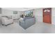 Bright living room featuring modern furnishings, neutral tones, and ample natural light at 1691 Lakeview Pl, Englewood, FL 34223
