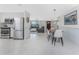 Open floor plan showcases a spacious living room and kitchen with lots of light at 1691 Lakeview Pl, Englewood, FL 34223