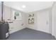 Image shows a utility room equipped with a water heater and a window at 1691 Lakeview Pl, Englewood, FL 34223