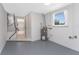 Image showing a utility room with modern water heater and access to basement at 1691 Lakeview Pl, Englewood, FL 34223