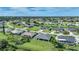 Aerial view of homes in a tranquil neighborhood surrounded by lush greenery and winding waterways at 171 Mark Twain Ln, Rotonda West, FL 33947