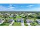 A picturesque aerial shot capturing a residential area, highlighting neat landscaping and a tranquil neighborhood atmosphere at 171 Mark Twain Ln, Rotonda West, FL 33947