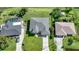 Overhead shot showcasing residential properties with well-maintained lawns, driveways, and hints of backyard pools at 171 Mark Twain Ln, Rotonda West, FL 33947