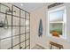 Bathroom features an expansive glass enclosed shower with modern fixtures and neutral color palette at 171 Mark Twain Ln, Rotonda West, FL 33947
