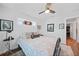 Cozy bedroom with neutral walls, ceiling fan, and natural light, creating a serene atmosphere at 171 Mark Twain Ln, Rotonda West, FL 33947