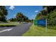 The Rotonda Community Park welcomes visitors with its lush greenery and inviting signage at 171 Mark Twain Ln, Rotonda West, FL 33947