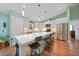 Bright kitchen with stainless steel appliances, a breakfast bar, and pendant lighting, creating a modern culinary space at 171 Mark Twain Ln, Rotonda West, FL 33947