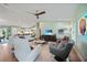 Spacious living room with modern furnishings, a large TV, and an open layout, perfect for entertaining at 171 Mark Twain Ln, Rotonda West, FL 33947