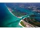 Stunning aerial view captures the beautiful coastline, waterways, and lush islands of Englewood at 1712 Fessler St, Englewood, FL 34223