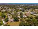 Expansive aerial view of the property showcasing lush landscaping and the surrounding neighborhood near the water at 1712 Fessler St, Englewood, FL 34223