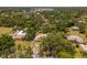 Lush greenery surrounds this serene property in a quiet neighborhood, offering privacy and a park-like setting at 1712 Fessler St, Englewood, FL 34223
